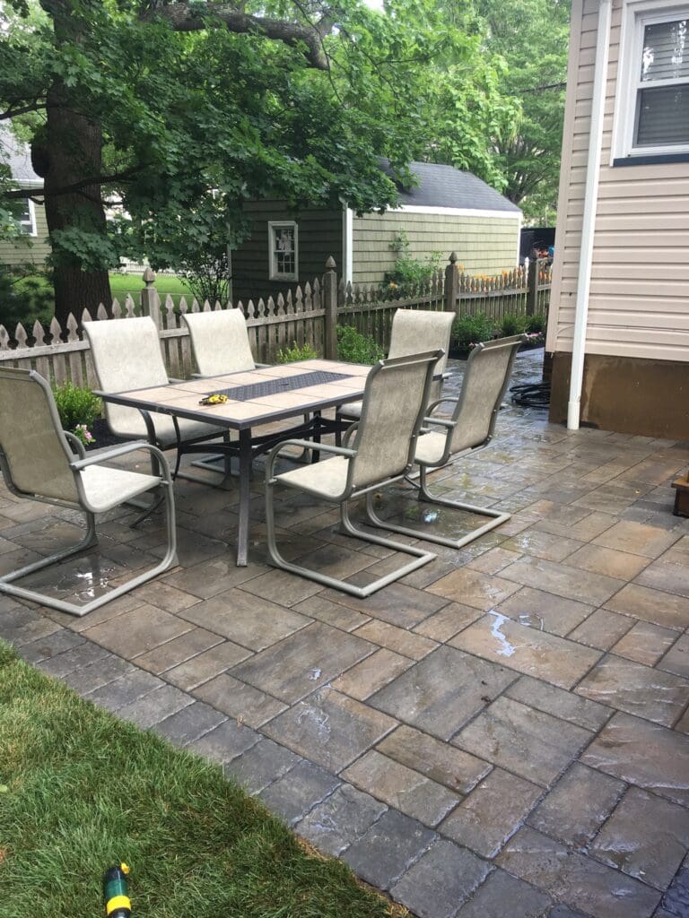 A dining table with chairs in an outdoor setting